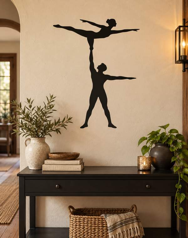 Black vinyl decal of balancing acrobat duo: one standing, one overhead balance pose
