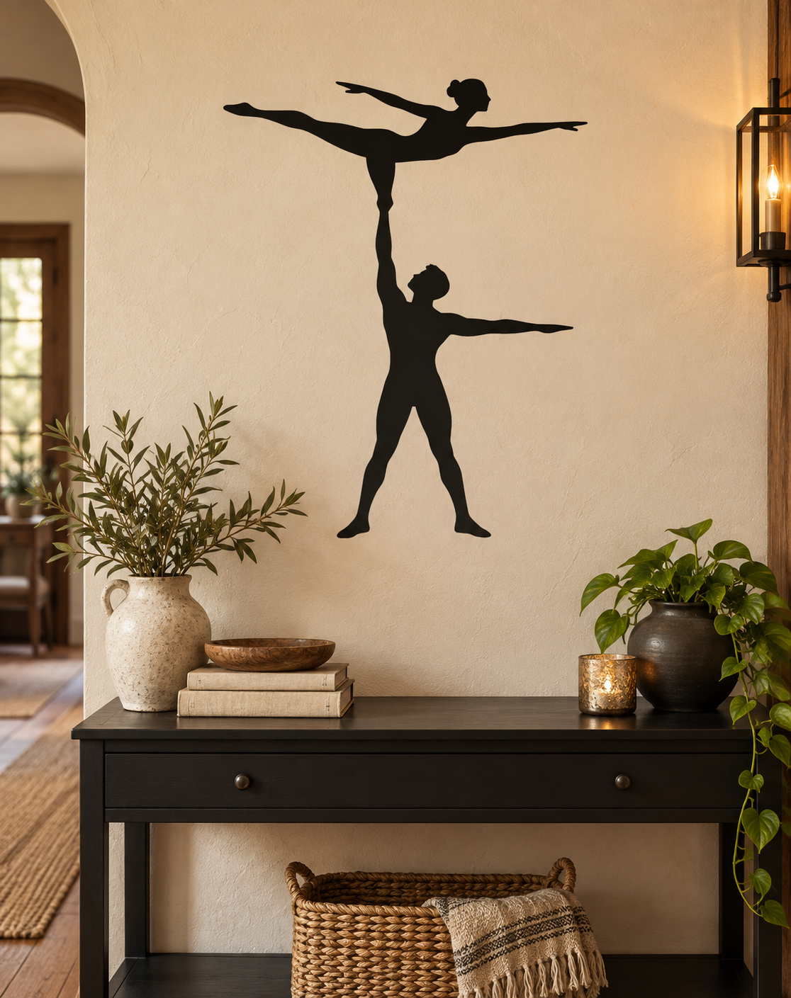 Black vinyl decal of balancing acrobat duo: one standing, one overhead balance pose