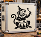 Circus monkey drum vinyl decal showing cartoon monkey playing a barrel drum