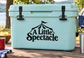 Black vinyl decal with circus tent and text "A Little Spectacle" on a cooler