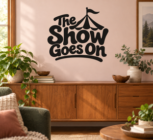 Black vinyl wall decal with circus tent and “The Show Goes On” lettering