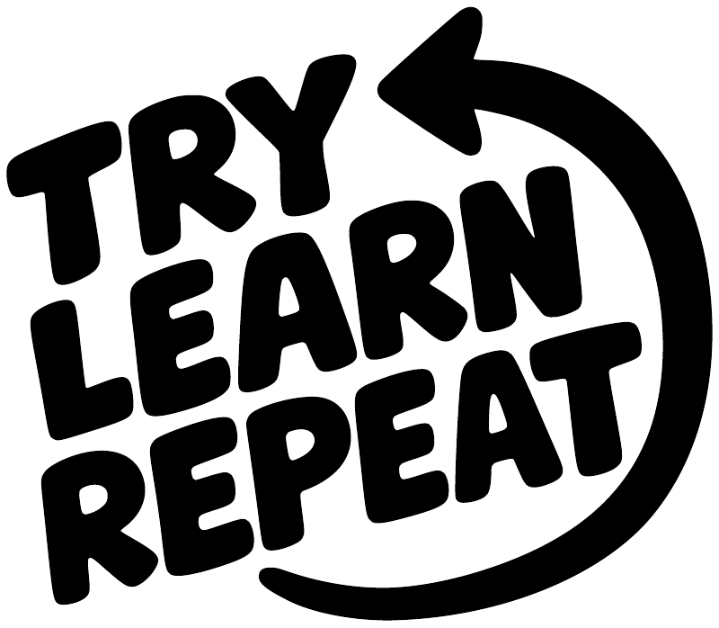Close-up black vinyl decal text “Try Learn Repeat” with arrow circle