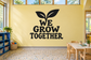 Classroom vinyl wall decal with sprout and bold text “WE GROW TOGETHER”