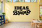 Vinyl wall decal reading "Ideas in Bloom" with flower icon