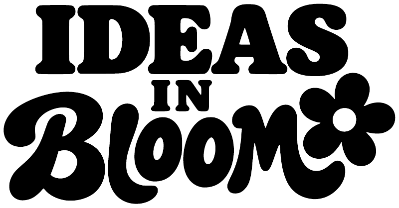 Close-up vinyl decal lettering: "IDEAS IN BLOOM" with flower graphic