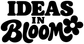 Close-up vinyl decal lettering: "IDEAS IN BLOOM" with flower graphic
