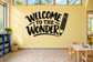 Welcome to the Wonder classroom vinyl wall decal with black outlined lettering and pencil icon