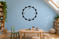 Petal-edged vinyl clock decal with black outline and numerals 12, 9, 3, 6