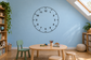 Wall vinyl clockface decal with black numbers around a circular minutes ring