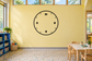 Bold Roman numeral clockface vinyl decal on wall