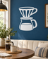 Coffee dripper vinyl decal with white outline and handle, on a blue wall