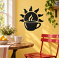 Coffee cup and sun vinyl decal, black graphic with white outlines on a wall
