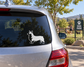 Vinyl decal dog side profile in black and white on a car rear window