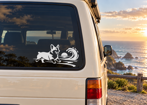 Vinyl decal of black-and-white corgi dog with wave swirl on a car window