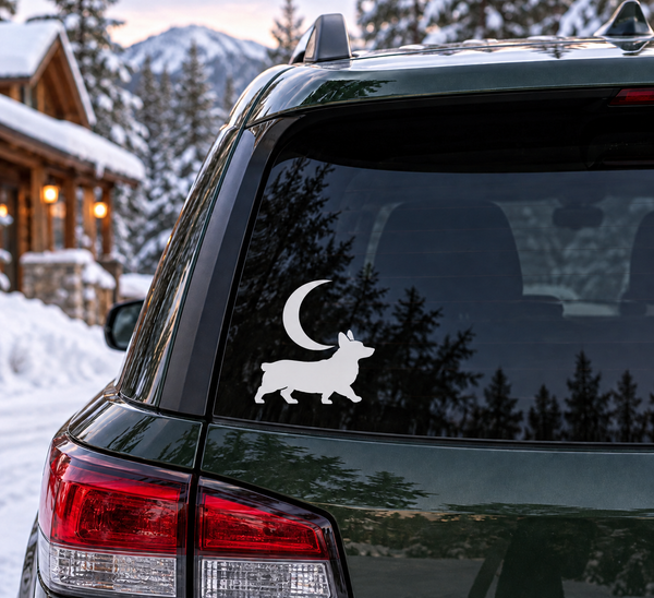 Vinyl decal: black crescent moon with corgi silhouette on car window