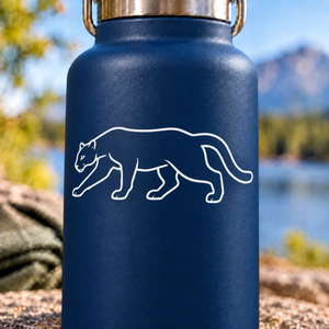Walking mountain lion outline vinyl decal with alert eyes, white on dark blue