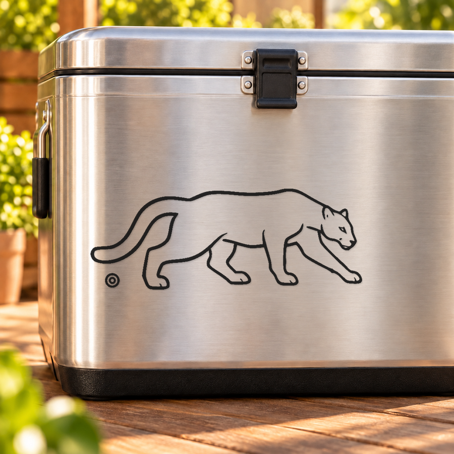 Black mirrored mountain cougar vinyl decal with two orbit-ring accents on a surface