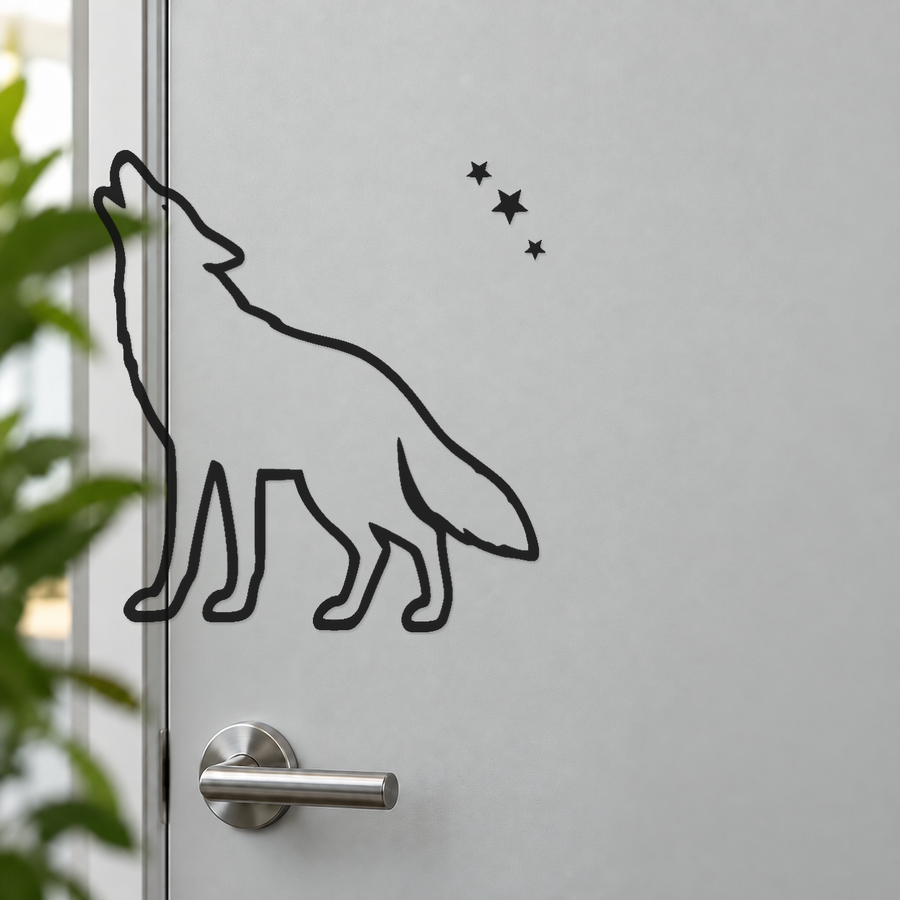 Howling coyote vinyl decal with three-star trail, black outline