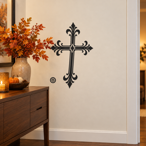 Ornate black cross vinyl wall decal with double orbit ring accents