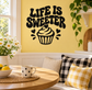 Black vinyl wall decal reading 'LIFE IS SWEETER' with cupcake and heart icons