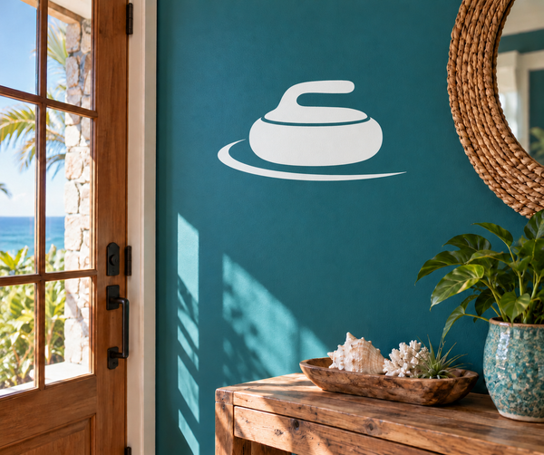 Curling stone glide vinyl decal with white curling stone graphic on teal wall