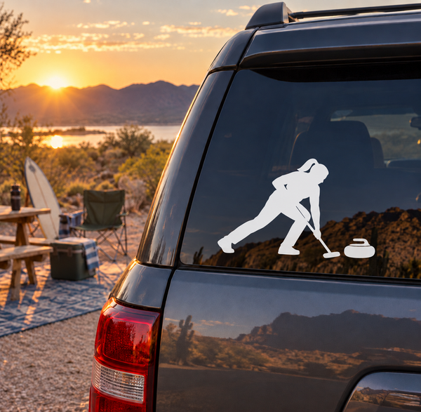 Curling sweeper vinyl decal featuring a white sweeper figure and rocks on a car window