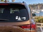 White vinyl sailboat and harbor horizon decal on car rear window