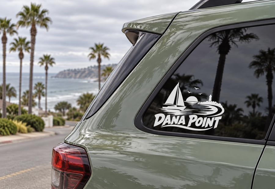 Sailboat wordmark vinyl decal on car window, white Dana Point logo