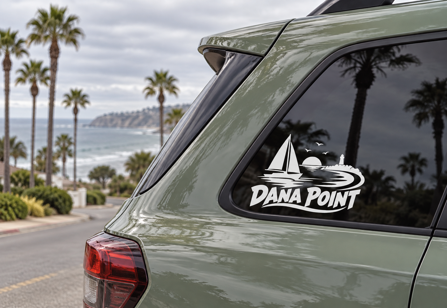 Sailboat wordmark vinyl decal on car window, white Dana Point logo