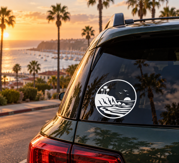 Circular vinyl decal with black-and-white coastal scene: palms, waves, birds