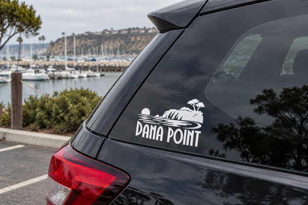 Dana Point headlands wordmark vinyl decal on black car trunk panel