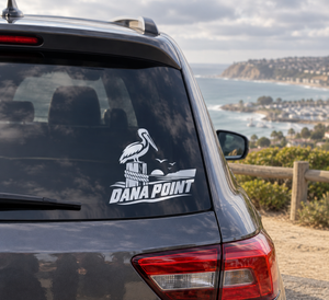 Pelican and Dana Point wordmark vinyl decal on car rear window