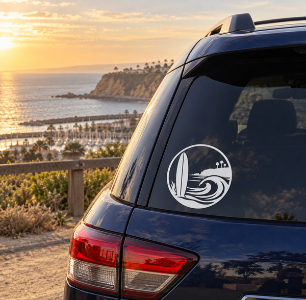 Circular white surf crest vinyl decal on dark car window