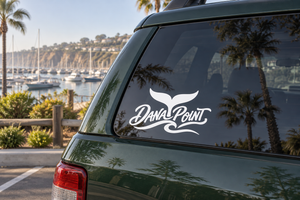 Dana Point lettering vinyl decal with winged logo on car window