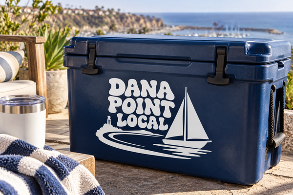 Navy cooler with vinyl decal: DANA POINT LOCAL and sailboat graphic