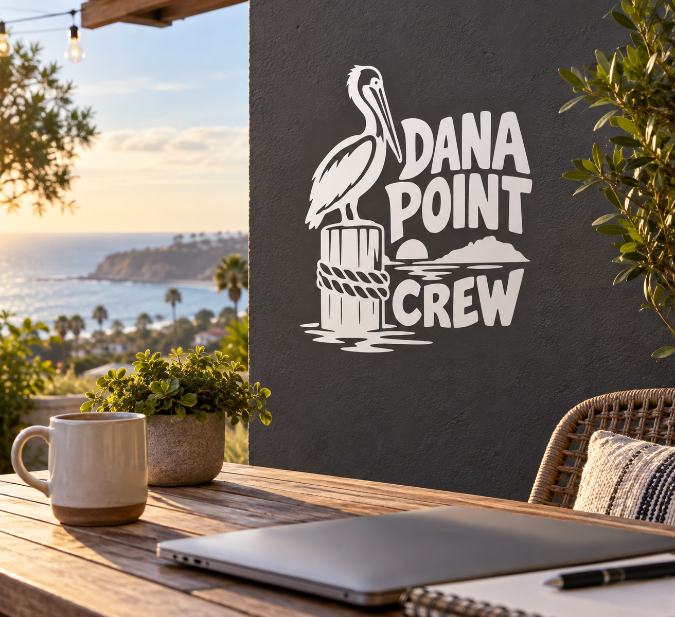 White vinyl decal with pelican and Dana Point Crew lettering