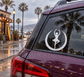 White circular ballerina vinyl decal on a car rear window with crescent border