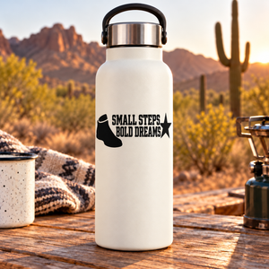 White bottle with black vinyl decal: SMALL STEPS BOLD DREAMS and star