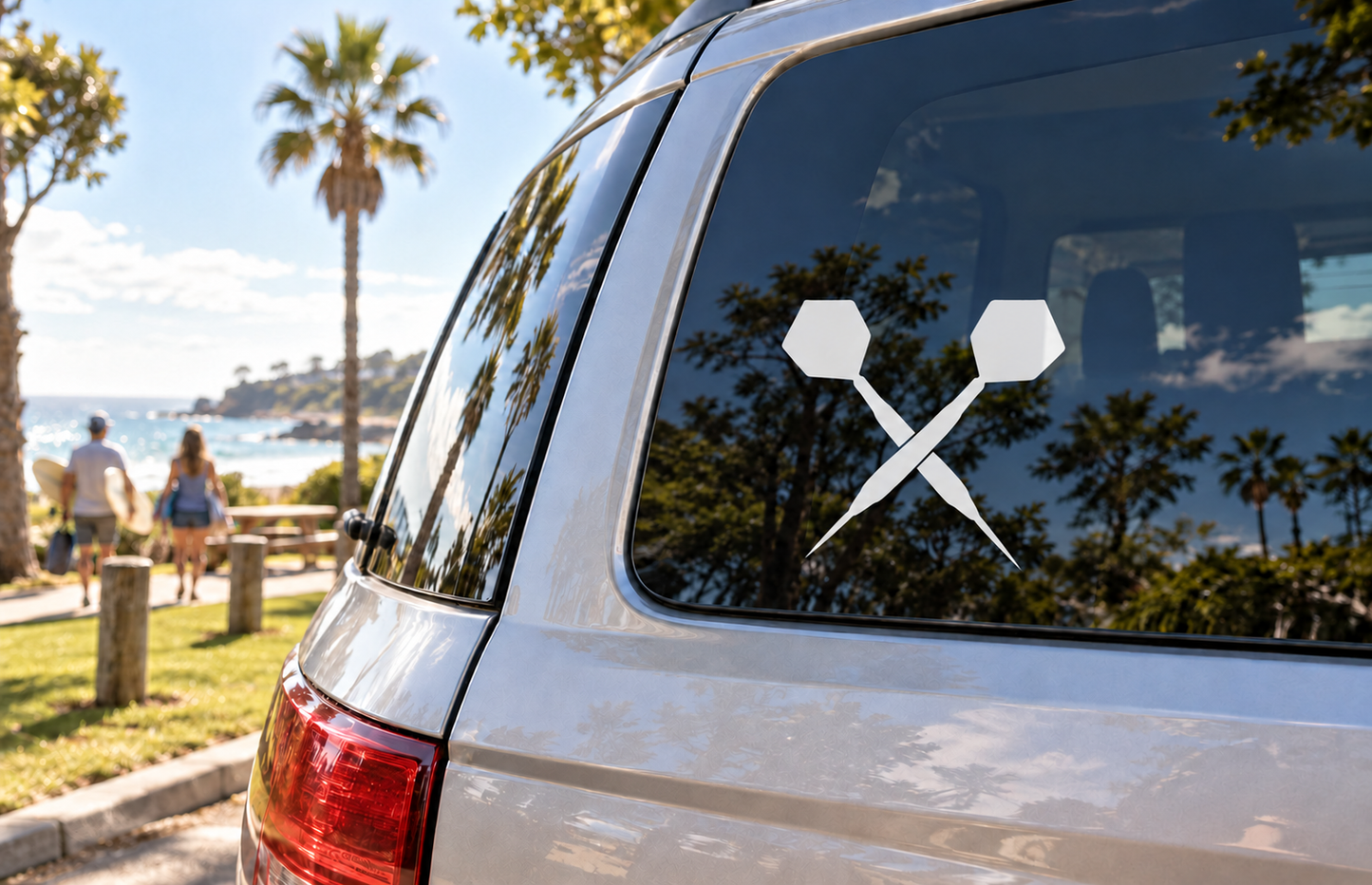 Vinyl dart decal with two crossed darts and white flight shapes on car window