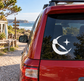 White crescent-and-dart vinyl decal on car rear window