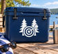 Blue vinyl decal of pine trees and a circular dart target on a cooler