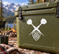 Crossed darts and target shield vinyl decal on olive-green surface