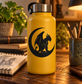 Black vinyl decal of a gargoyle on a crescent moon, shown on a bottle