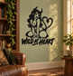 Black demon-girl vinyl wall decal with heart, pose, and bold 'Wild at Heart' text