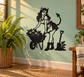 Black vinyl decal of devil girl gardening with flowers, pitchfork, and watering can