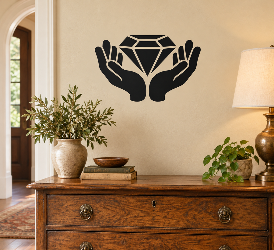 Vinyl decal of open hands holding a faceted diamond silhouette