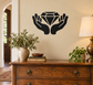 Vinyl decal of open hands holding a faceted diamond silhouette