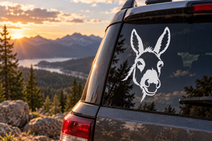Donkey portrait vinyl decal with tall ears and flowing mane on a vehicle window