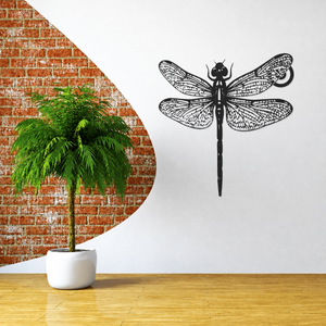 Black metal dragonfly wall art with layered halo and detailed veined wings
