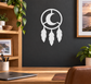 Crescent moon dreamcatcher vinyl decal with three dangling feather drops, black and white